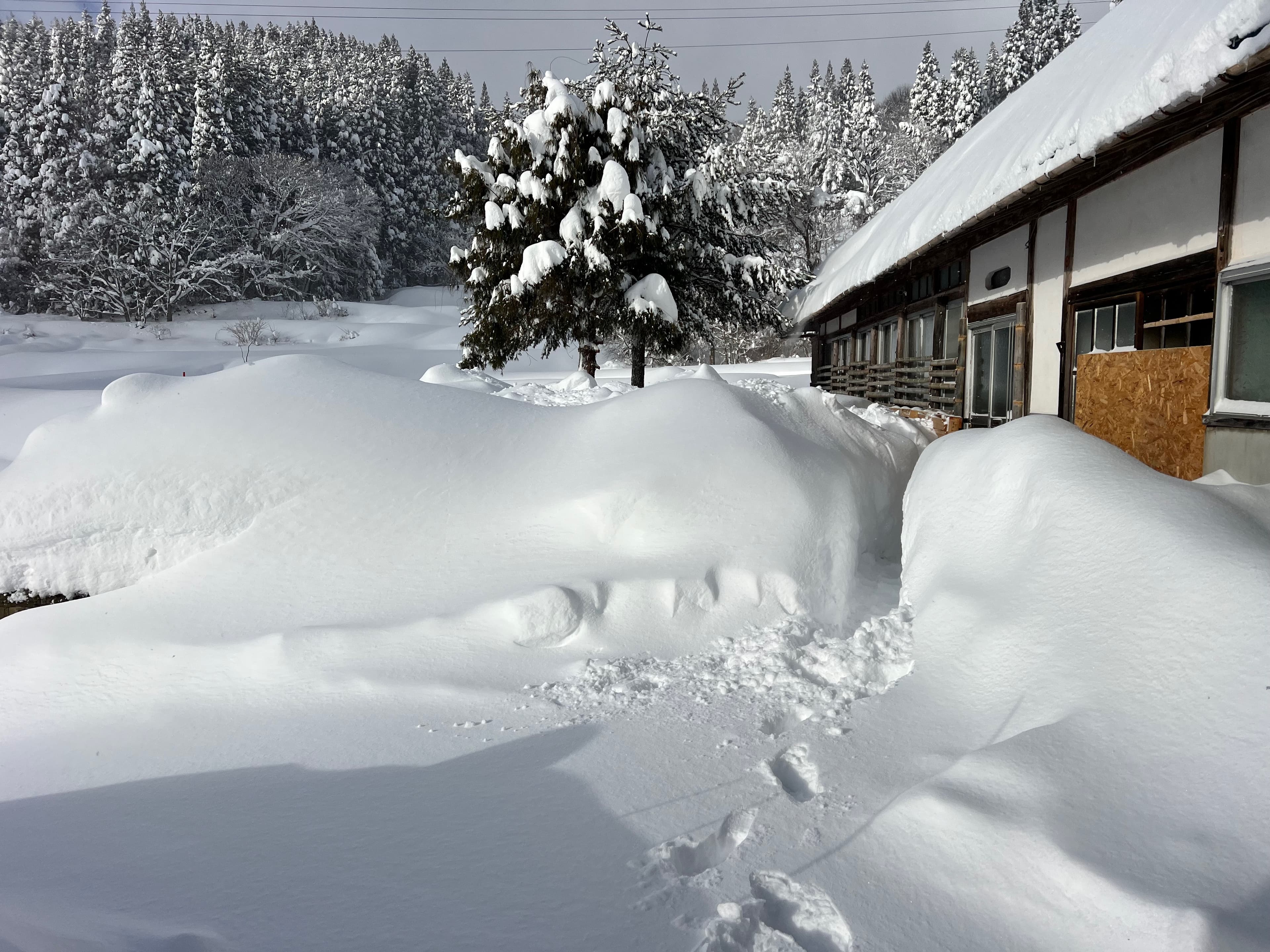 The main house under deep winter snow