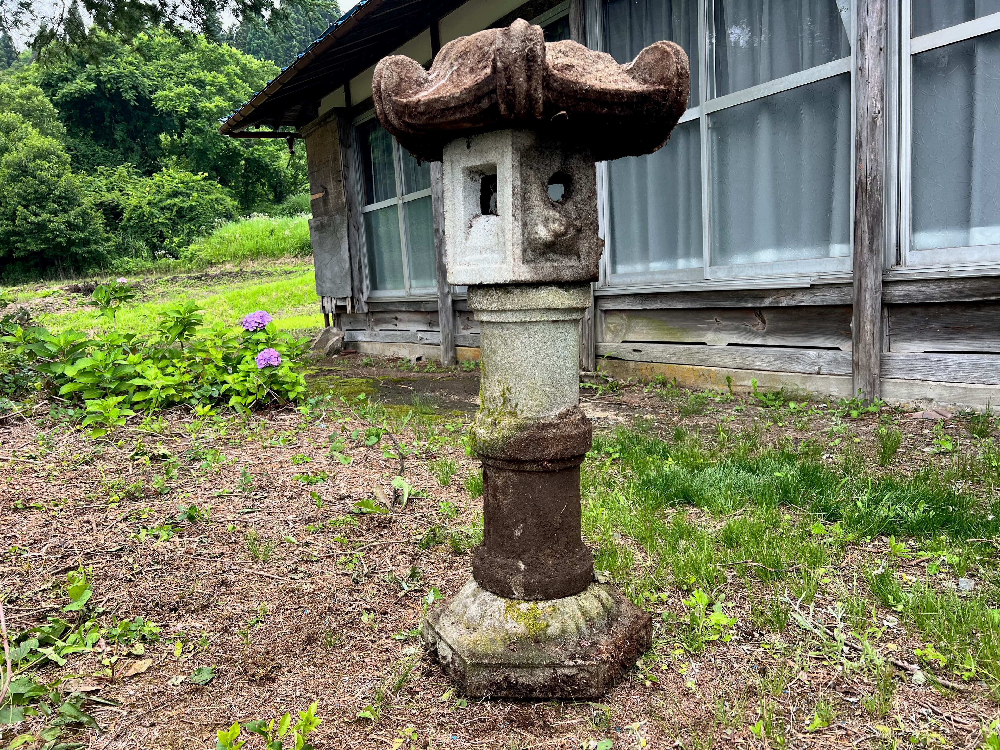 Garden lantern unearthed from the soil at the property
