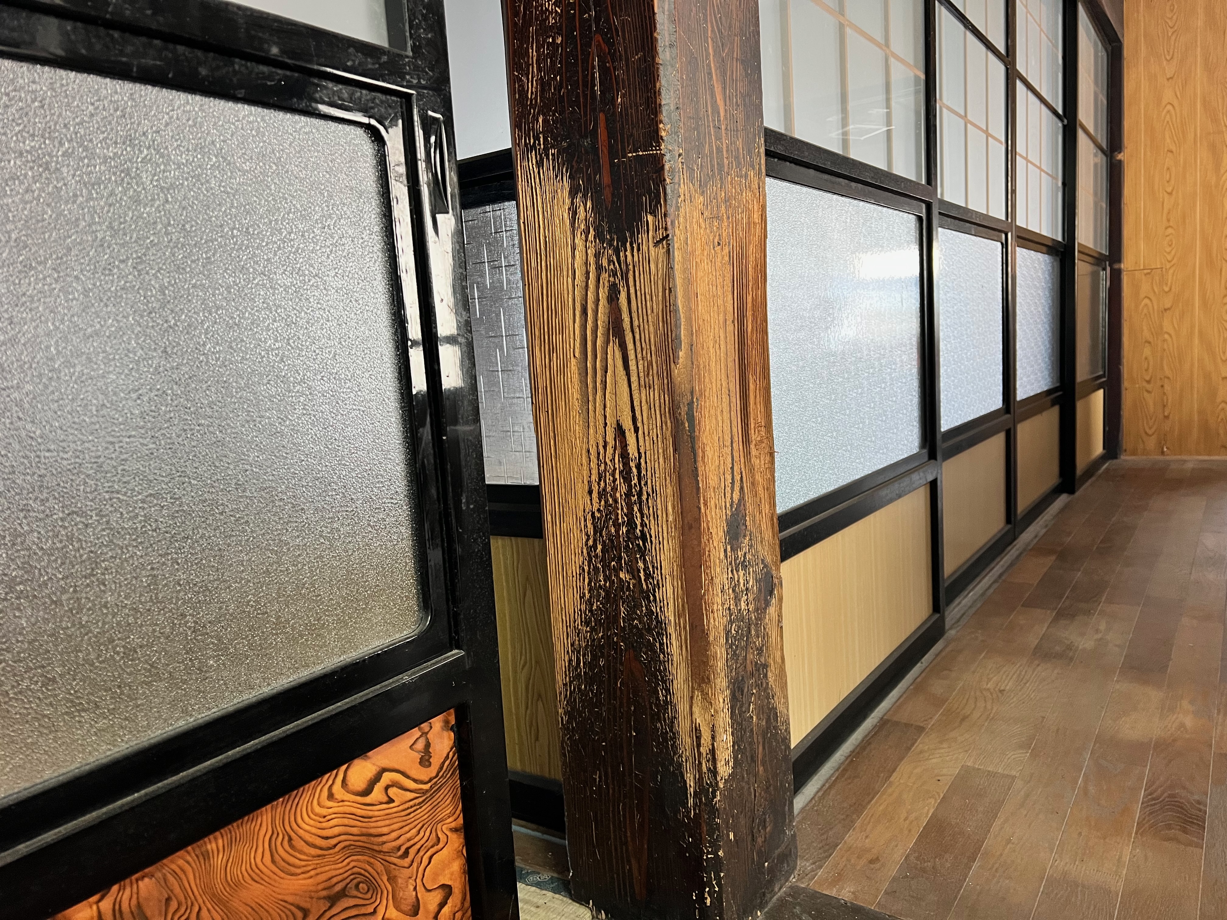 Claw marks etched into the pillar of the main house — the trace of a beloved cat